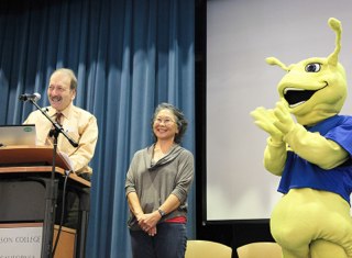 Sammy the Slug helps Chancellor Blumenthal present the Outstanding Staff Award to Elaine Kihara.